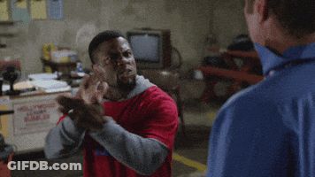Man In Red Shirt Pointing At Man In Blue Shirt GIF