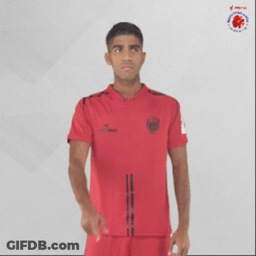 Man In Red Shirt Pointing At Mouth GIF