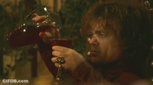 Man In Red Shirt Pouring Drink Into Glass GIF