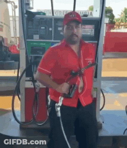 Man In Red Shirt Pumping Gas GIF