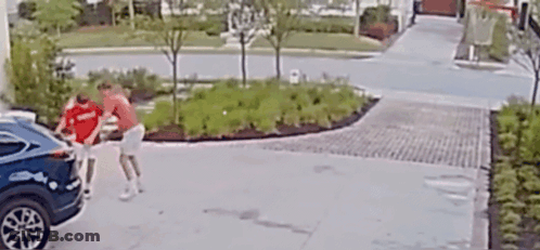 Man In Red Shirt Pushing Blue Car In Driveway GIF