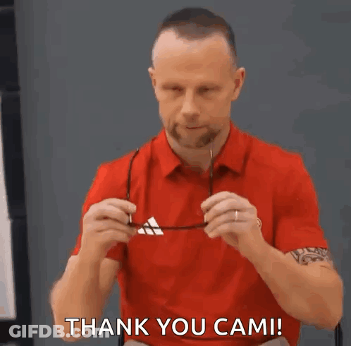 Man In Red Shirt Putting On Glasses Saying Thank You Cam GIF