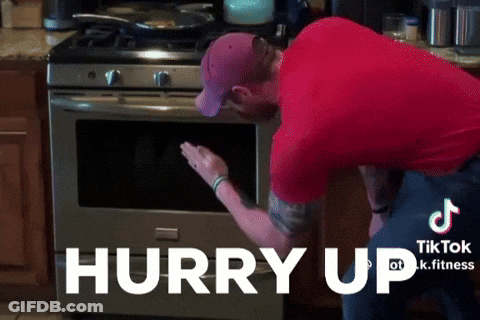 Man In Red Shirt Reaching Into Oven Hurry Up GIF