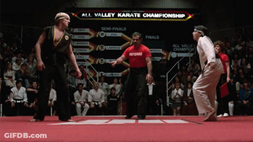 Man In Red Shirt Referee Karate Championship Board GIF