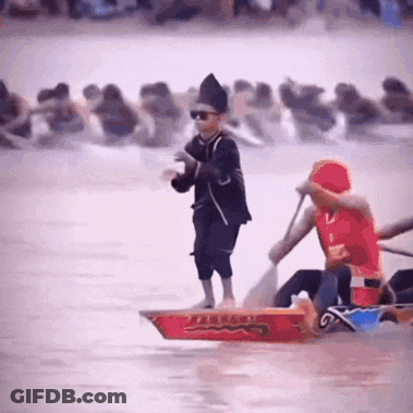 Man In Red Shirt Rowing Boat With Chinese Writing GIF