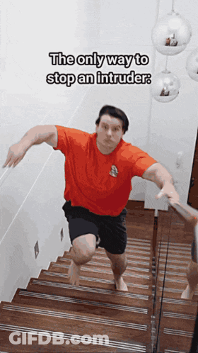 Man In Red Shirt Running Down Stairs GIF