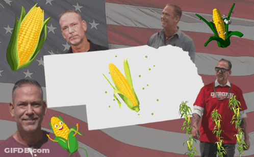 Man In Red Shirt Saying Cowboys In Front Of American Flag GIF