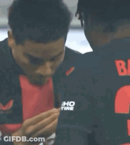Man In Red Shirt Saying Ent Blowing Kiss GIF