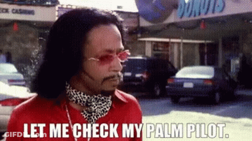 Man In Red Shirt Saying Let Me Check My Palm Pilot GIF
