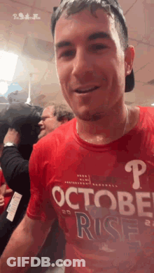 Man In Red Shirt Saying October Rise GIF
