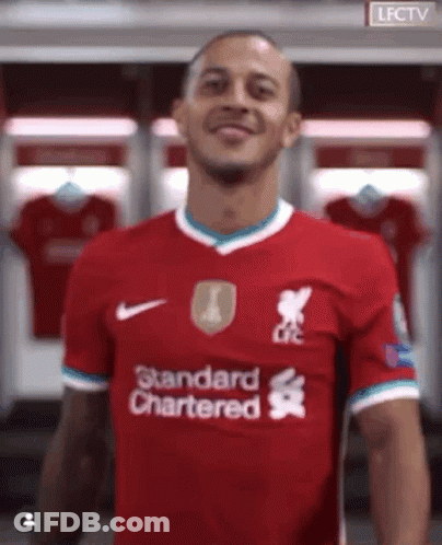 Man In Red Shirt Saying Standard Chartered GIF
