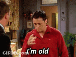 Man In Red Shirt Says I'm Old To Another Man GIF