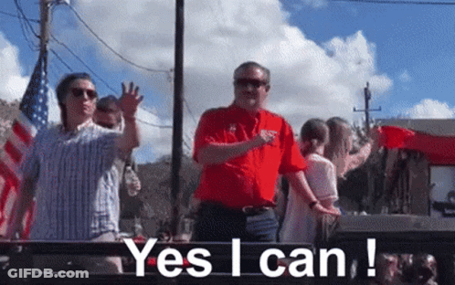 Man In Red Shirt Says Yes I Can In Front Of Crowd GIF
