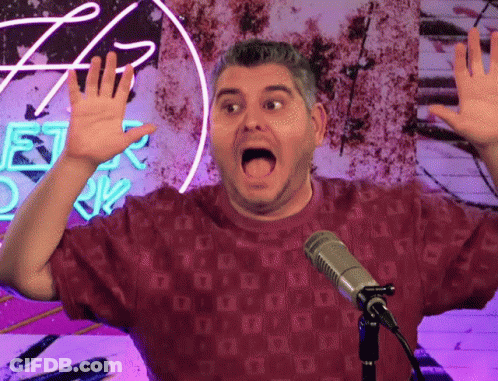 Man In Red Shirt Singing At Microphone GIF