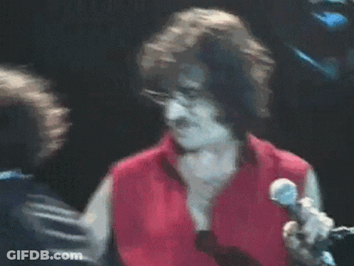 Man In Red Shirt Singing Into Microphone GIF