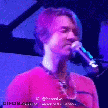 Man In Red Shirt Singing Into Microphone GIF