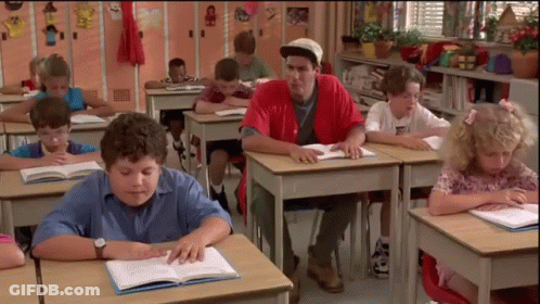 Man In Red Shirt Sitting At Desk With Children GIF