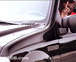 Man In Red Shirt Sitting In Black Ford Explorer GIF