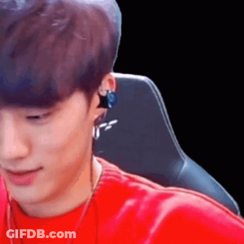 Man In Red Shirt Sitting In Chair Wearing Headphones GIF