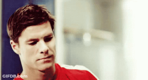 Man In Red Shirt Sitting In Locker Room GIF