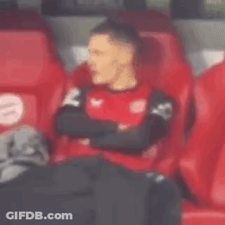 Man In Red Shirt Sitting In Stadium GIF