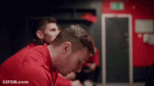Man In Red Shirt Sitting GIF