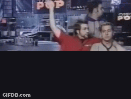 Man In Red Shirt Sitting Next To Man In Grey 92 GIF
