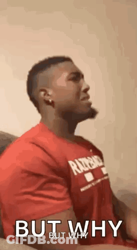 Man In Red Shirt Sitting On Couch Talking GIF