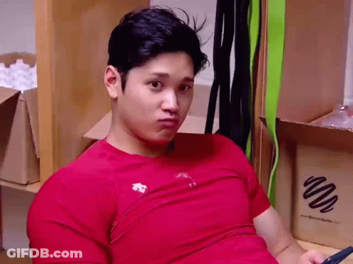 Man In Red Shirt Sitting With Cell Phone GIF