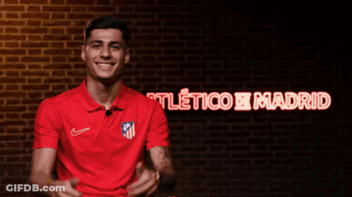 Man In Red Shirt Smiling At Atlético Madrid GIF