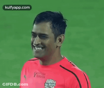 Man In Red Shirt Smiling At Camera GIF