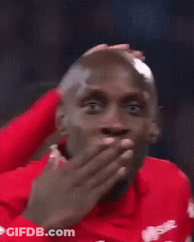 Man In Red Shirt Smiling At Camera GIF