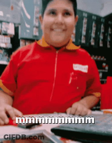 Man In Red Shirt Smiling Holding Calculator GIF