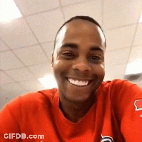 Man In Red Shirt Smiling Taking Selfie GIF