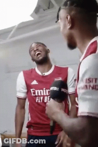 Man In Red Shirt Speaking Into Microphones GIF