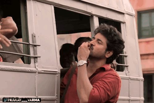 Man In Red Shirt Standing Before Bus Pranay Varma GIF