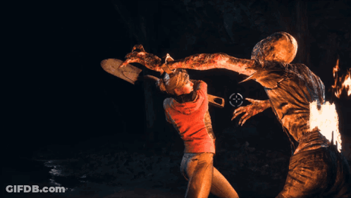 Man In Red Shirt Standing Beside Burning Monster GIF
