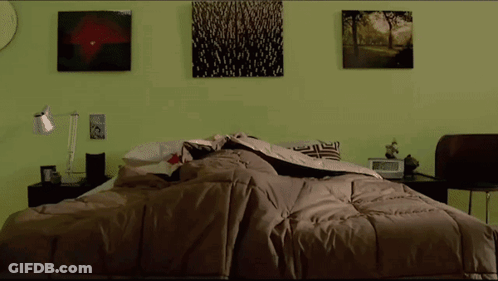 Man In Red Shirt Standing In Bed GIF