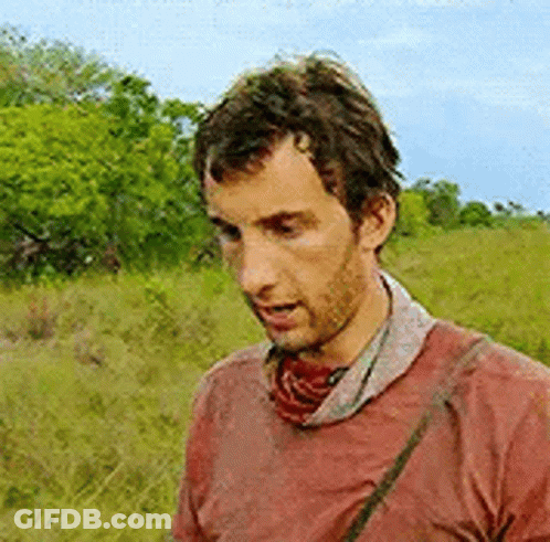 Man In Red Shirt Standing In Field GIF