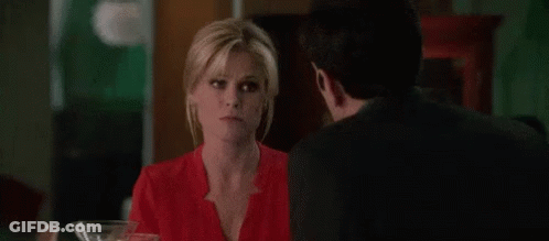 Man In Red Shirt Standing Next To Another Man GIF