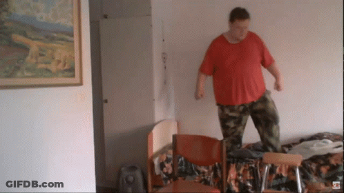 Man In Red Shirt Standing On Chair GIF