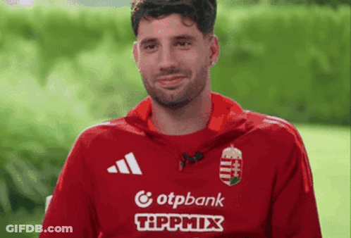 Man In Red Shirt Surrounded By Two Red Hearts With Name Szobo GIF