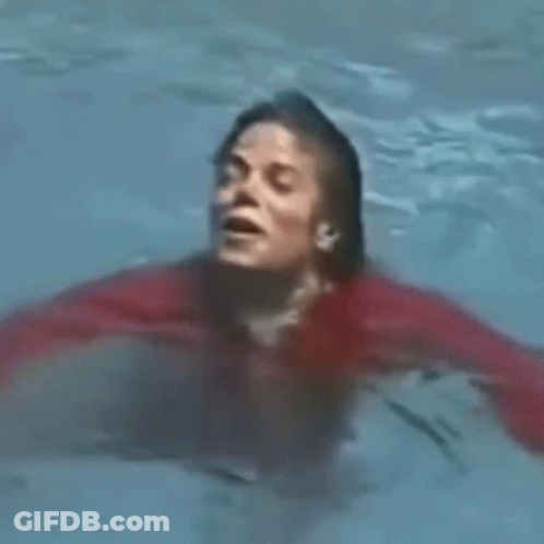 Man In Red Shirt Swimming With Mouth Open GIF