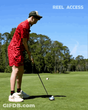 Man In Red Shirt Swinging Golf Club GIF