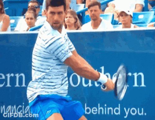 Man In Red Shirt Swinging Tennis Racquet GIF