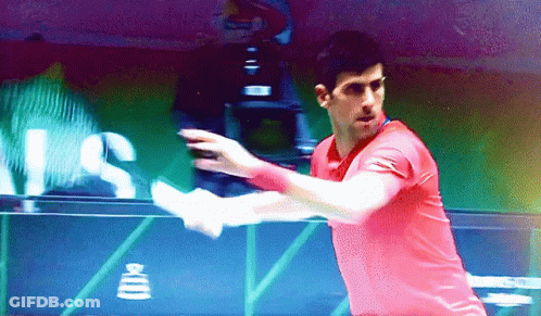 Man In Red Shirt Swinging Tennis Racquet With US Sign GIF