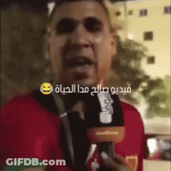Man In Red Shirt Talking Into Microphone GIF