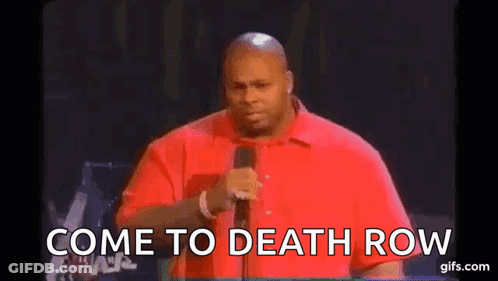 Man In Red Shirt Talking Into Microphone GIF