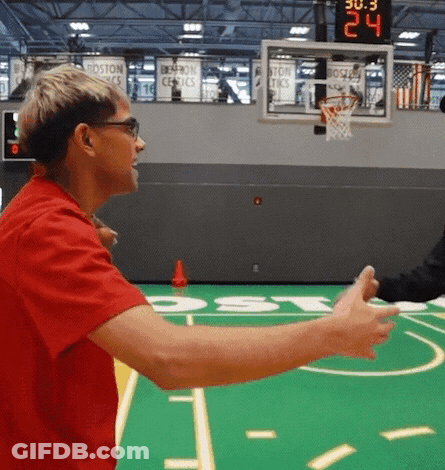Man In Red Shirt Talking To Another Man On Basketball Court Score 24 To 30 GIF