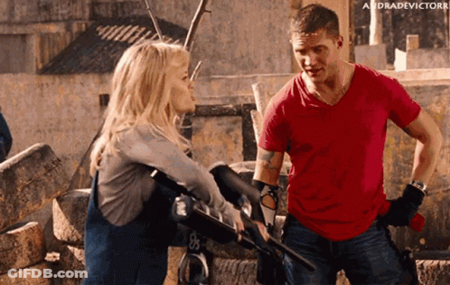 Man In Red Shirt Talking To Woman GIF